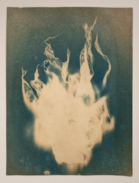 a black and white photograph of a fire