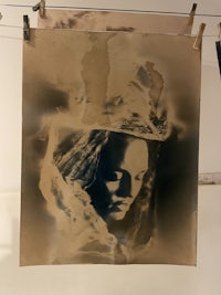 a black and white photograph hanging on a wall