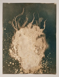 a black and white photograph of a white blob on a blue background