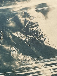 a black and white photo of a woman in a dress