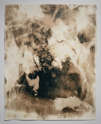 a black and white photo of a painting on a wall