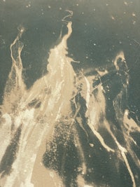 a black and white photo of a waterfall
