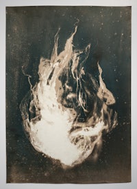 a black and white photograph of a fire
